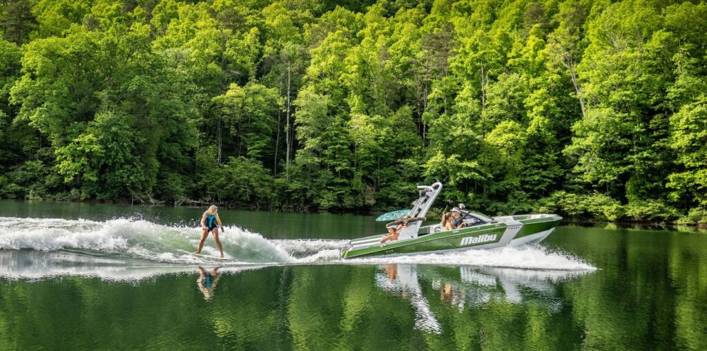 Malibu 21 LX with person wake boarding of the back