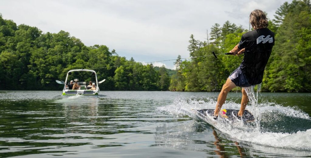 Malibu 21 LX with person water skiing off the back