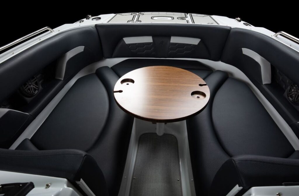 seating with small table in the bow on the 2023 Four Winns HD5Surf