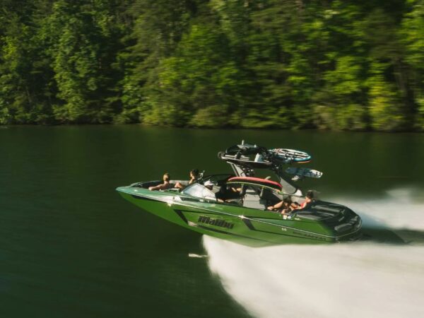 Malibu 23 MXZ with a dark forest green hull