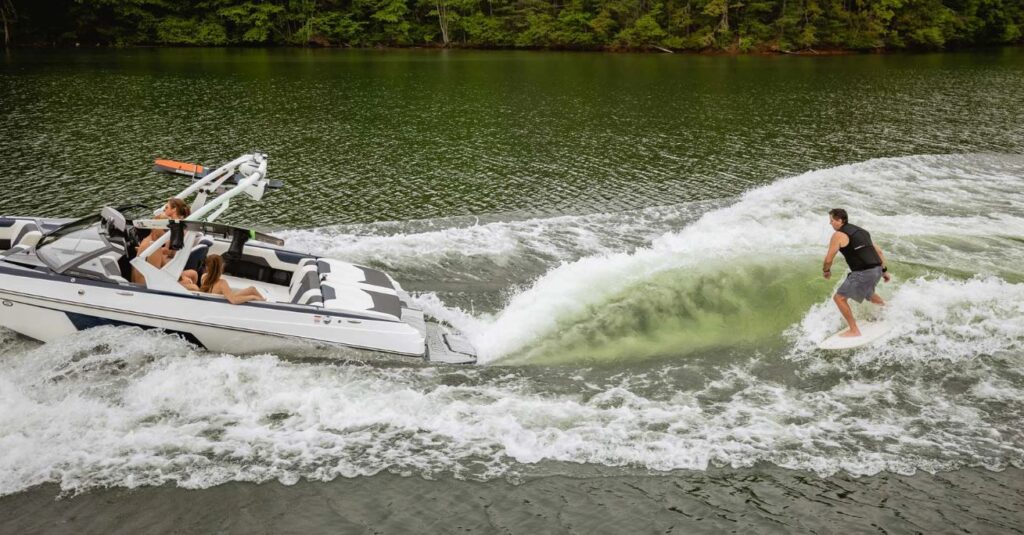 Malibu 20 VTX with person wake boarding of the back