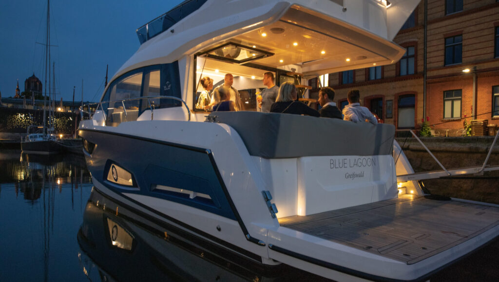 2023 Sealine F430 at night with interior lights on