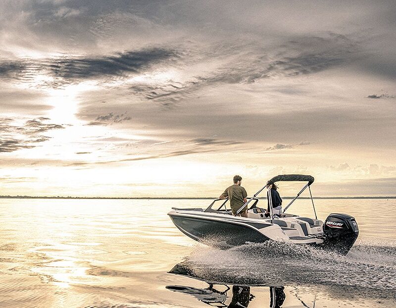 Boat driving out into the sunset