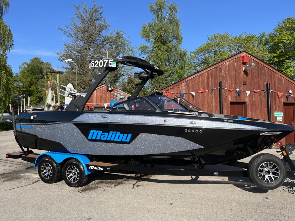 2022 Malibu 23 LSV black and silver hull with blue text