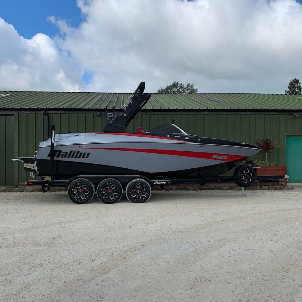 2019 Malibu M235 in silver with a red stripe