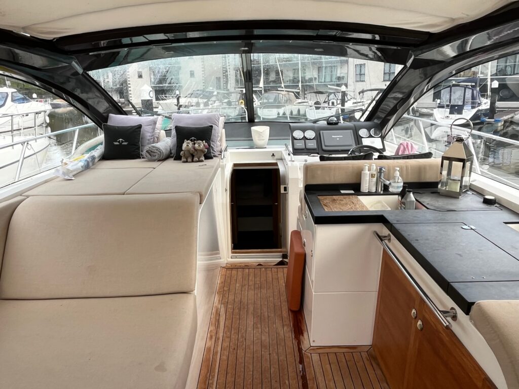 top decking area with seating, driving station and kitchen unit