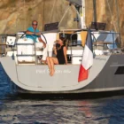 person sitting on the back of the Wauquiez Pilot Saloon 48e
