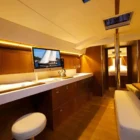 living area with apple mac computer on desk